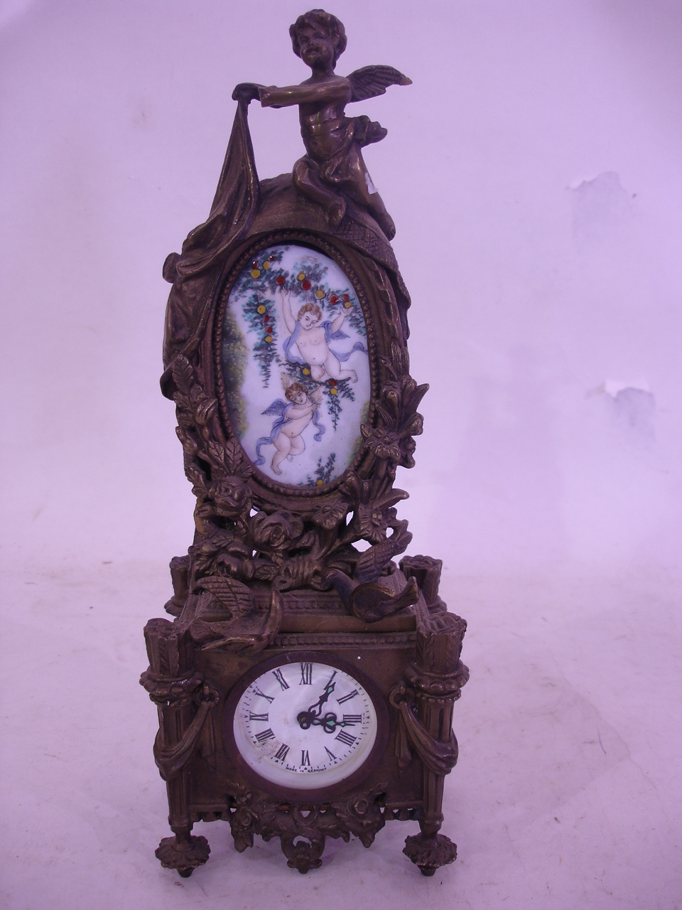 A gilt bronze cased mantle clock, the movement later. 12" high