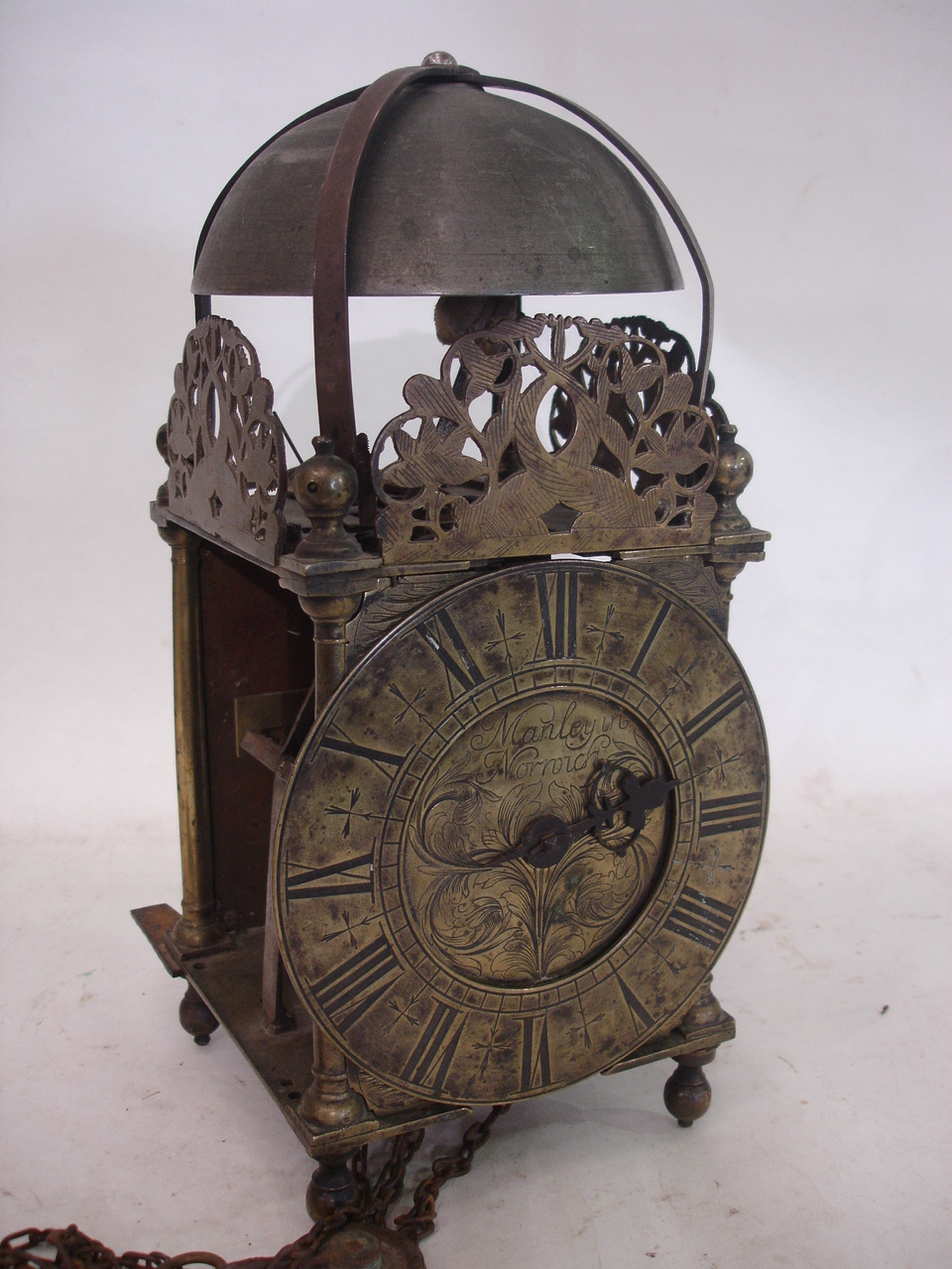 A brass lantern clock, the dial signed Manley in Norwich, the movement with anchor escapement and