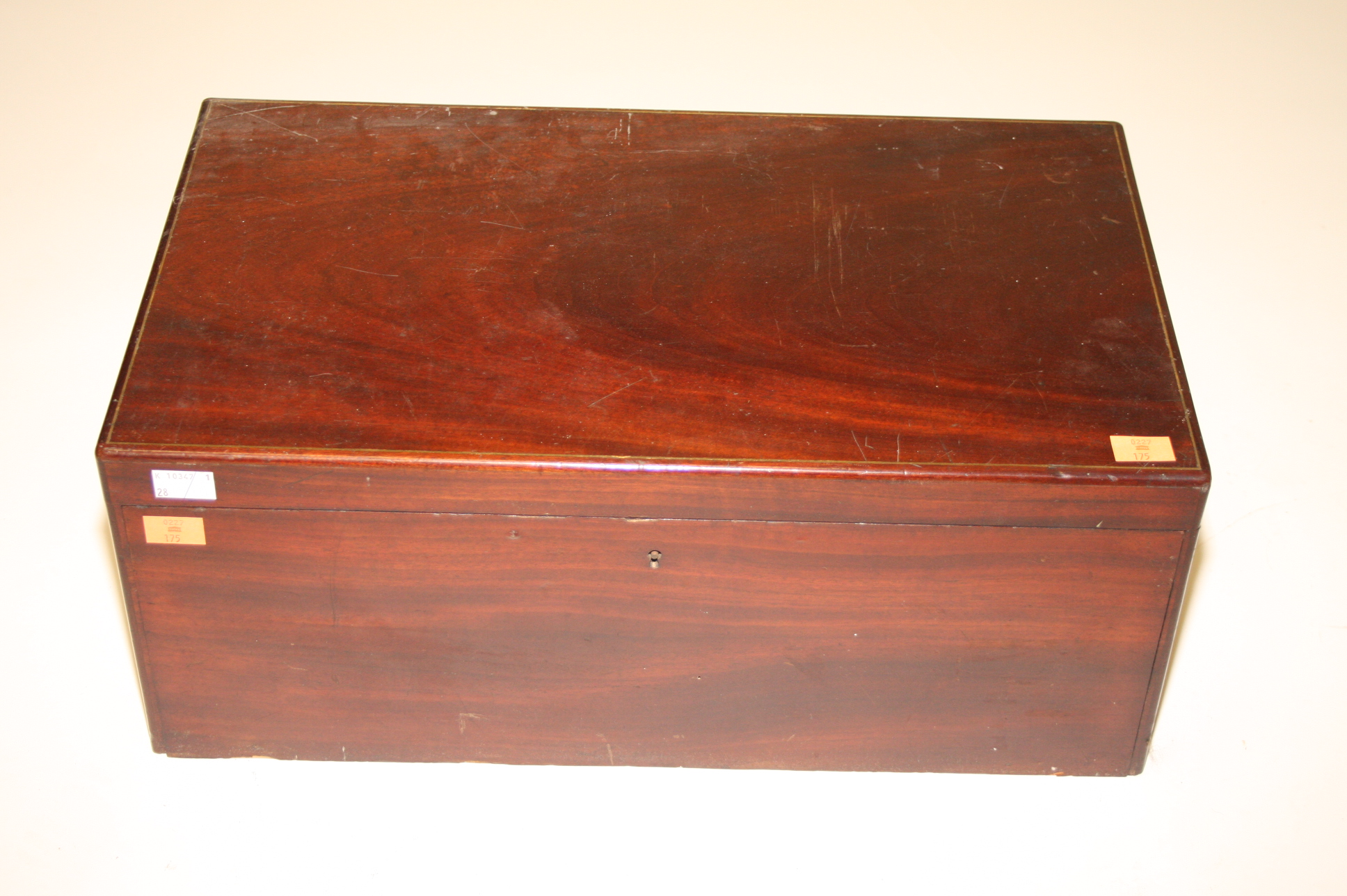 A 19TH CENTURY MAHOGANY AND BRASS INLAID VANITY CASE,
the rectangular top, opening to reveal a