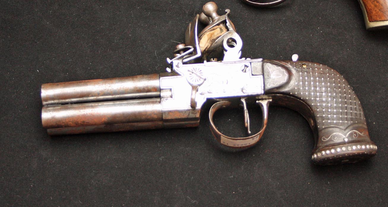 A VERY UNUSUAL CONTINENTAL DOUBLE FLINT LOCK FOUR BARREL  PISTOL, 
with two triggers, and a safety