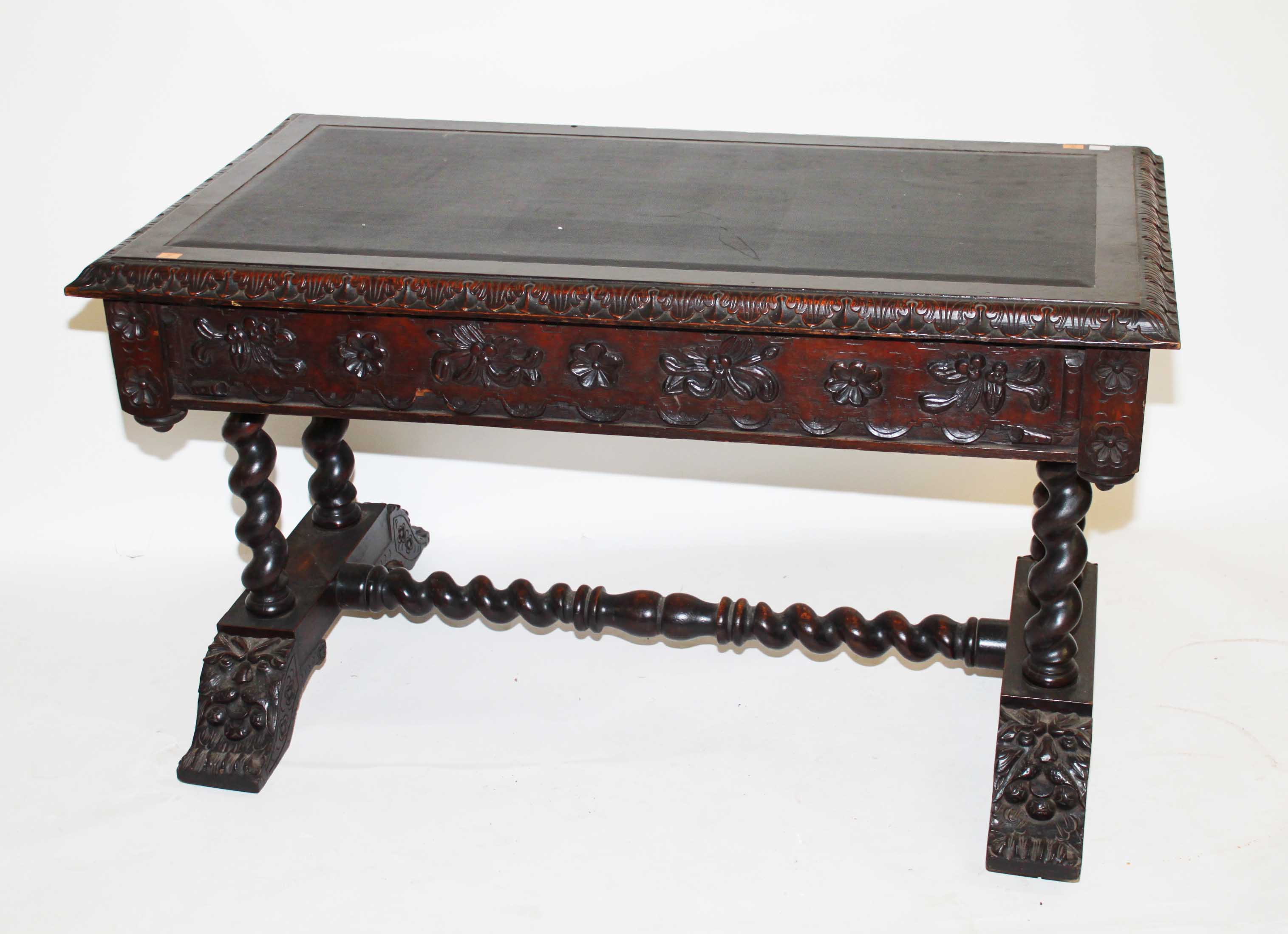 A Carved Oak Library Table,
19th Century, in the 17th century style, the rectangular top with a