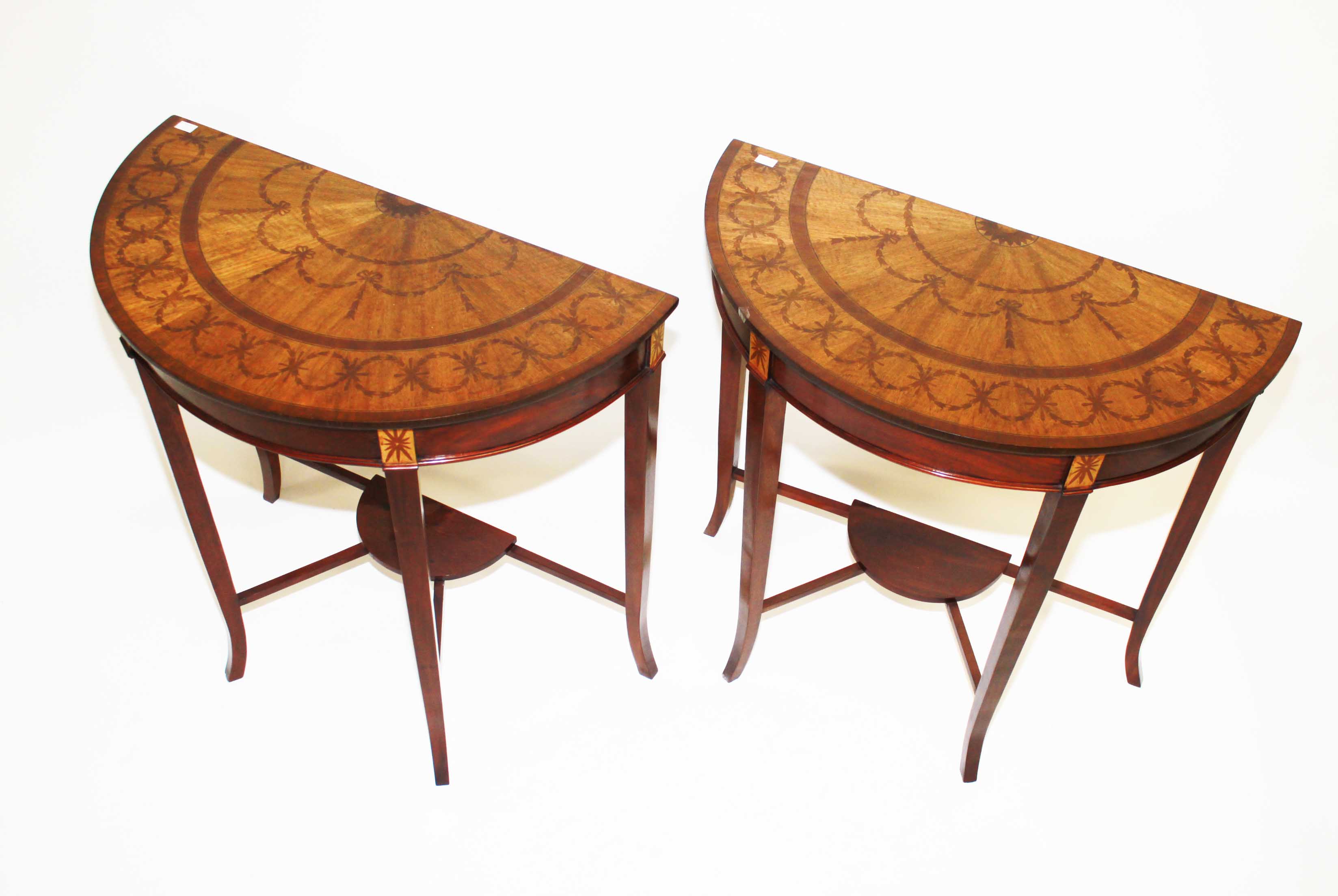 A pair of Demi-Lune Mahogany and Marquetry inlaid Side Tables,
O.R.M., each top inlaid with