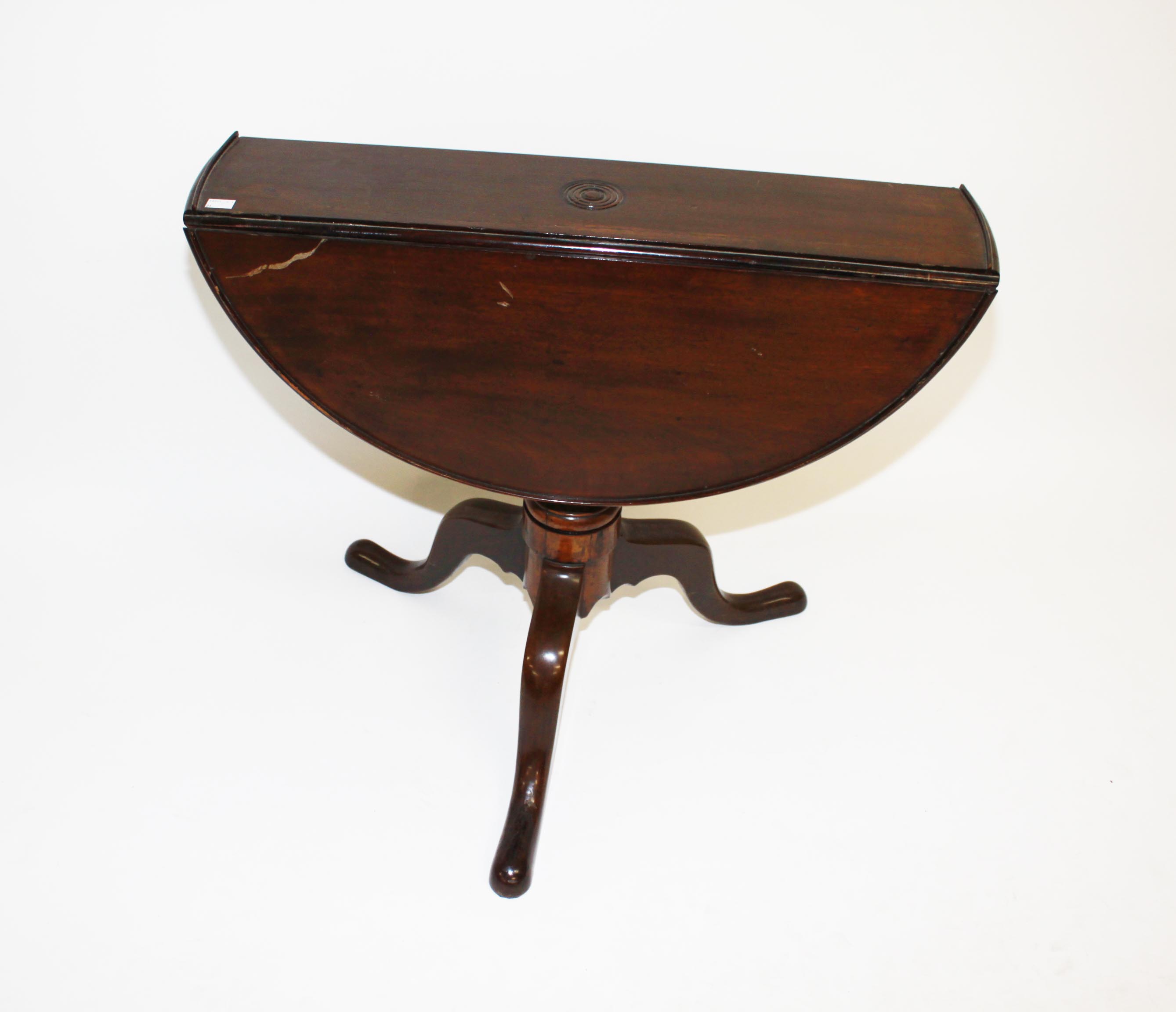A MAHOGANY DROPLEAF TABLE, 
19th century, with demilune flaps, on a baluster turned stem, on