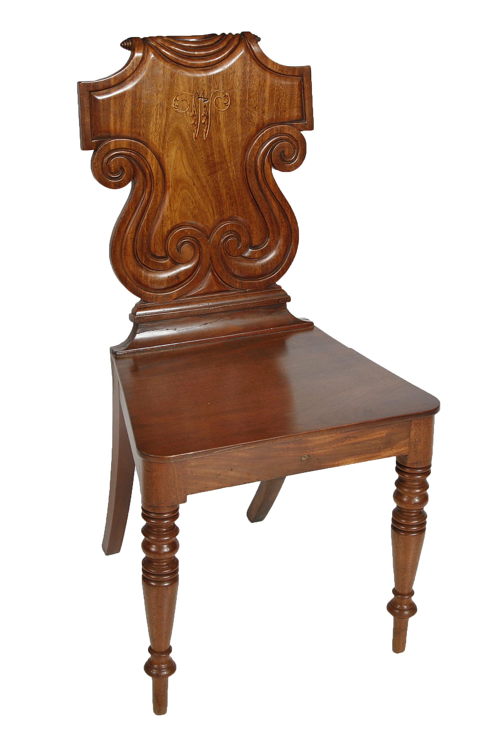 A WILLIAM IV MAHOGANY HALL CHAIR, 
the shield shape back, painted with a monogram within scrolls,
