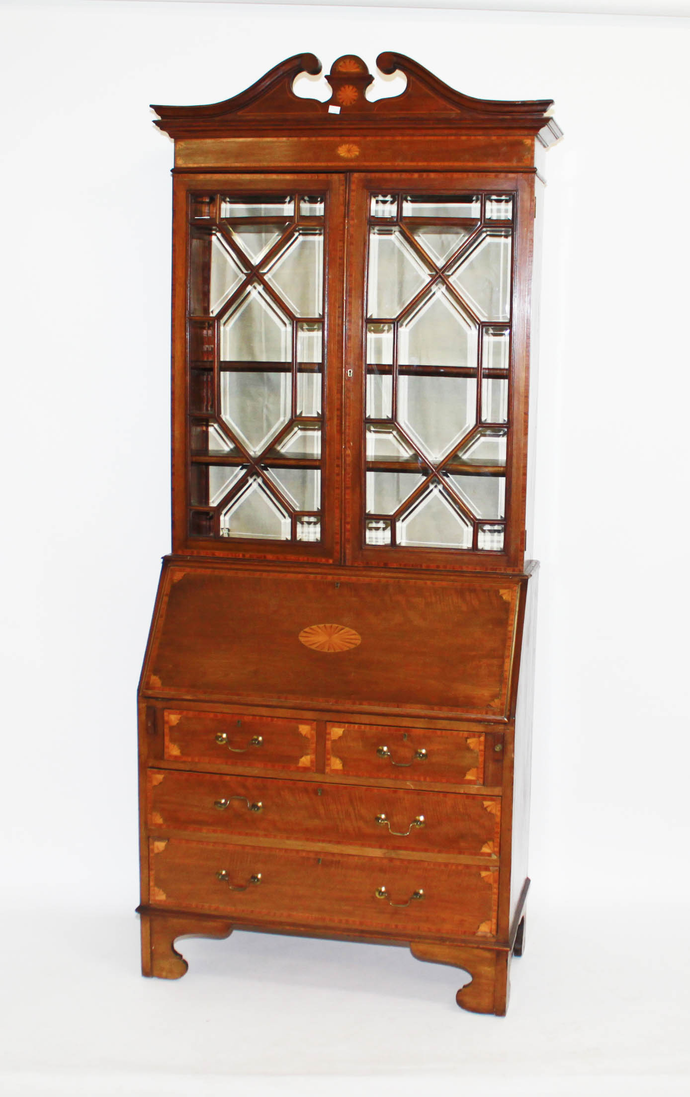 A MAHOGANY SATINWOOD CROSSBANDED AND INLAID BUREAU BOOKCASE,
late 19th century, with broken swan