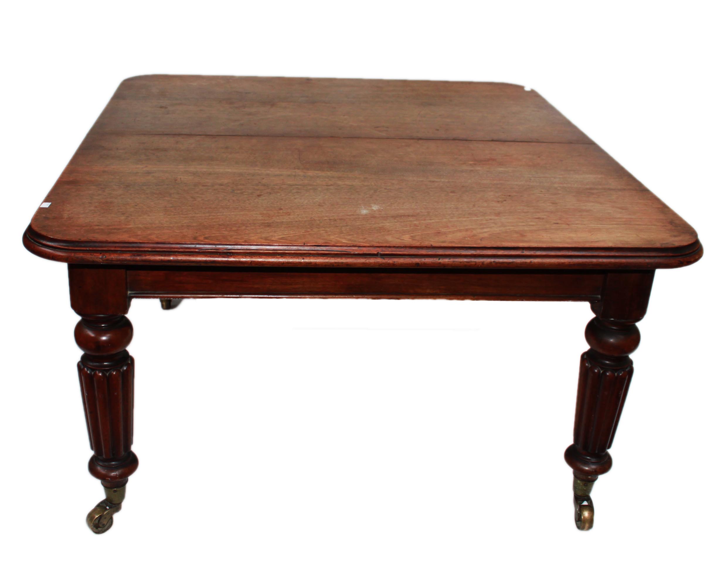 A VICTORIAN MAHOGANY TELESCOPIC DINING TABLE, 
the rectangular top with moulded edge, raised on