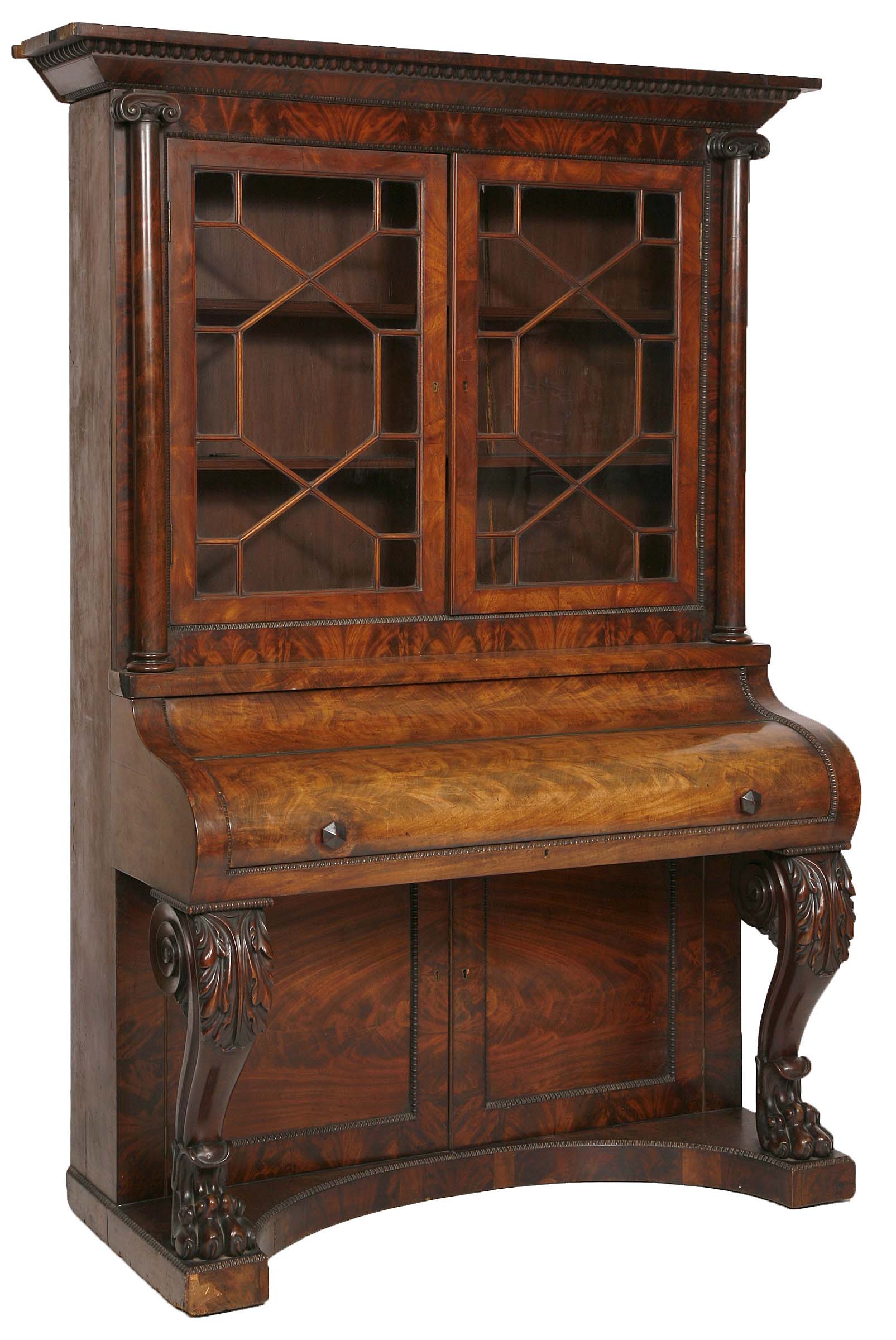 A FLAMED MAHOGANY PIANO BOOKCASE,
c.1840, with moulded egg and dart cornice and nulled rim, above