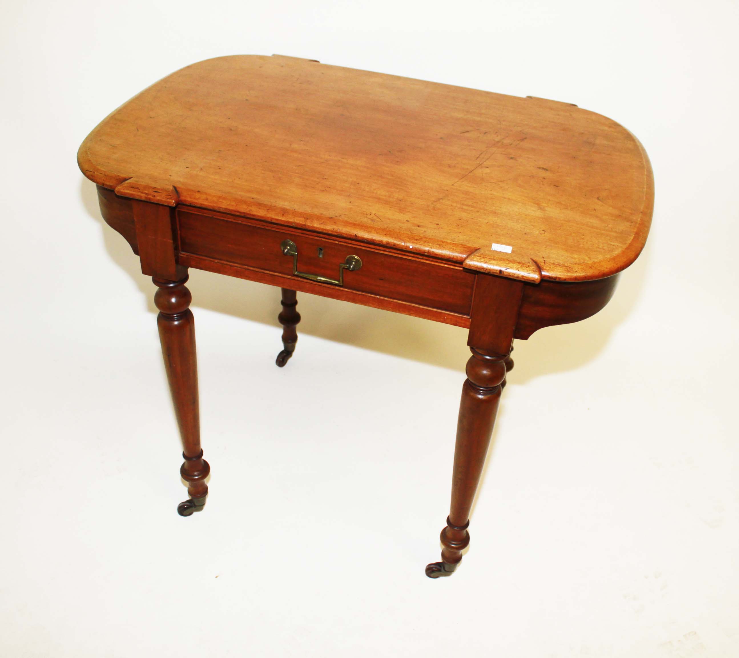 A VICTORIAN MAHOGANY SIDE OR CENTRE TABLE, 
the rectangular top with bowed ends, above a frieze
