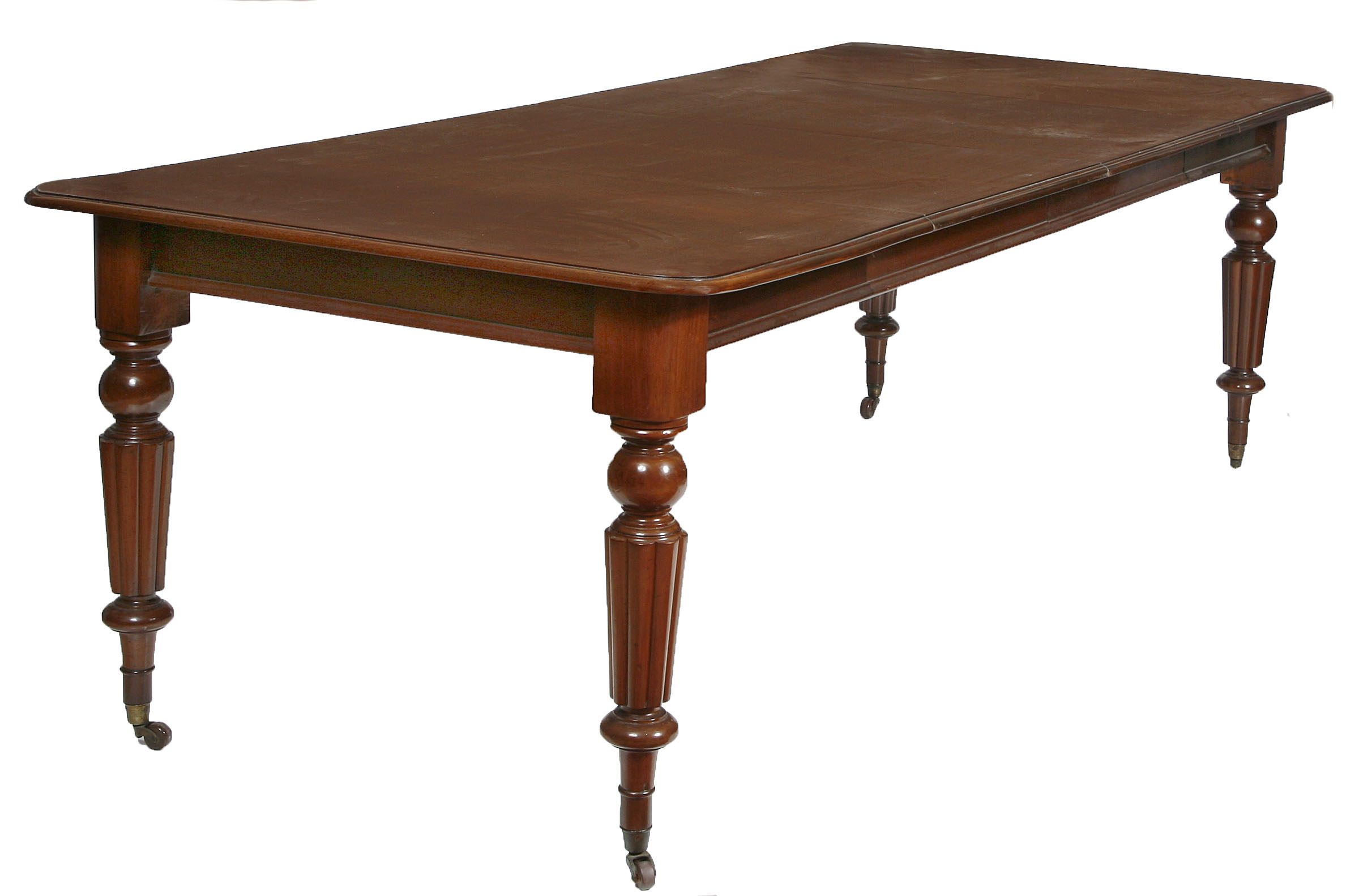 A MAHOGANY DINING TABLE,
Victorian and later, with two spare leaves and a moulded edge, raised on