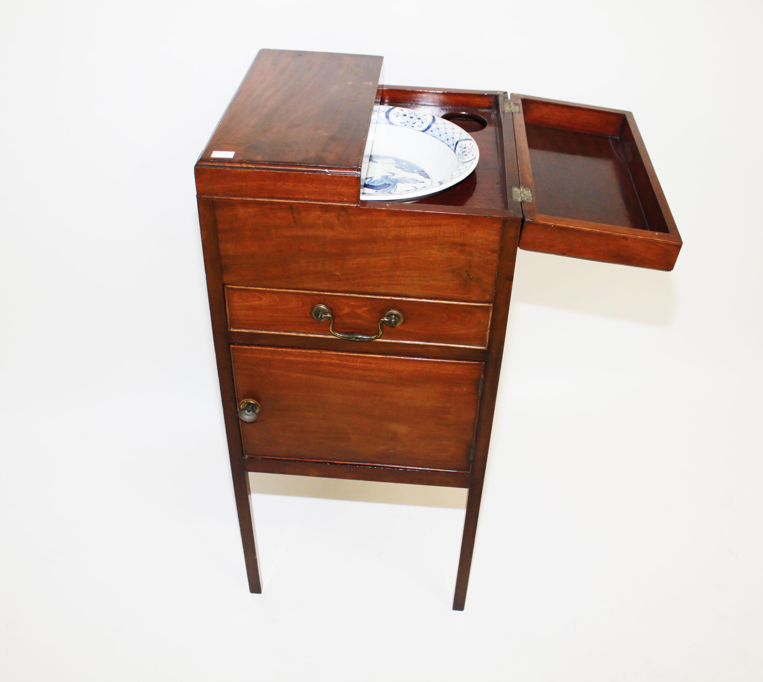 A Mahogany Wash Stand, 
early 19th century, the hinged and divided top opening to reveal an