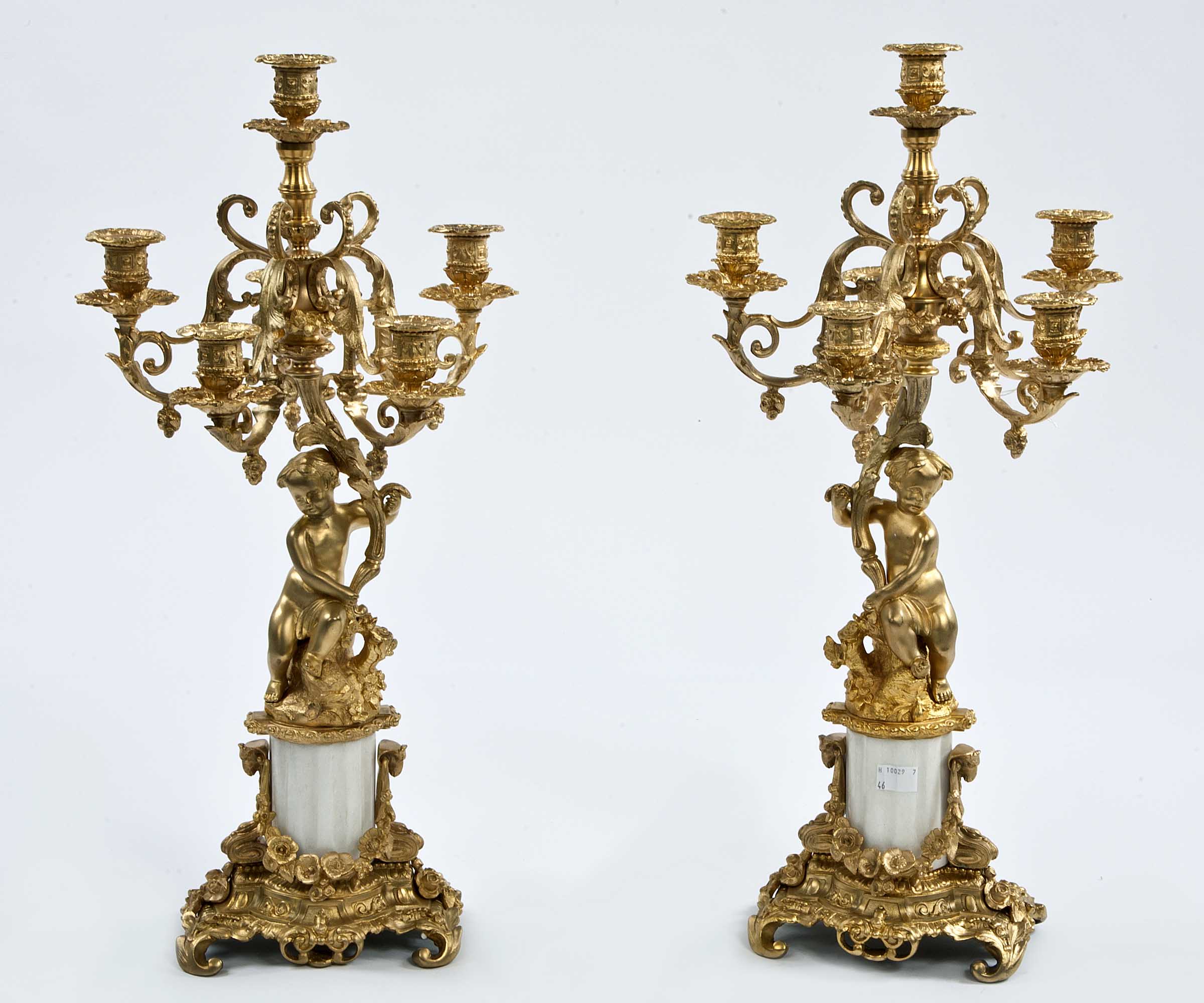 AN ATTRACTIVE PAIR OF GILT BRASS AND WHITE MARBLE CANDELABRA, O.R.M., each with five leaf scroll