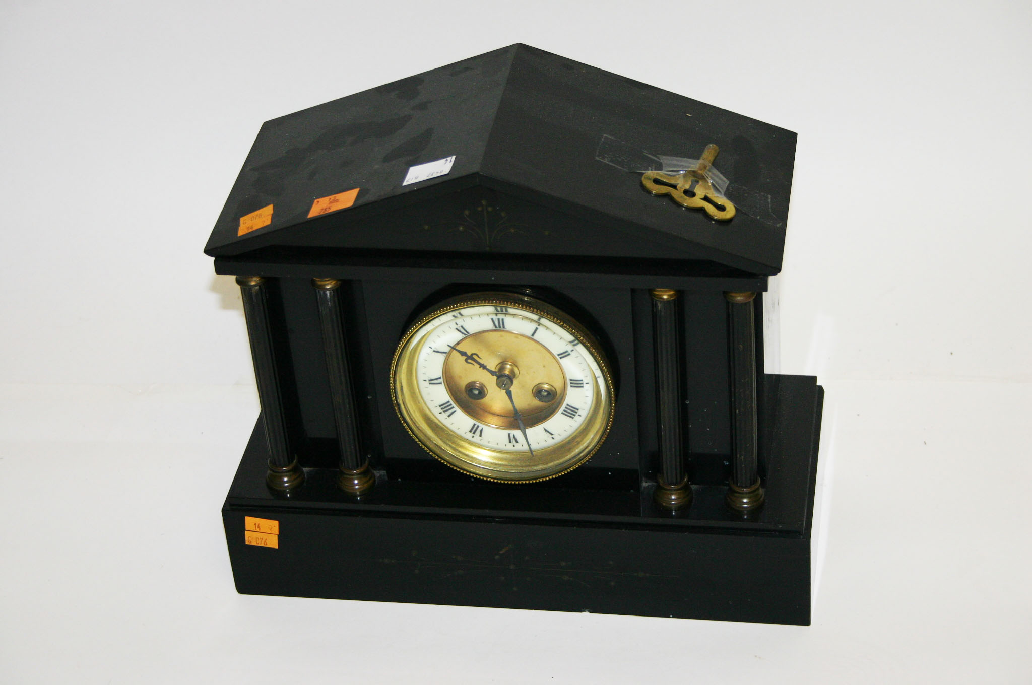 AN EDWARDIAN BLACK MARBLE MANTEL CLOCK, with white enamel dial. (1)
