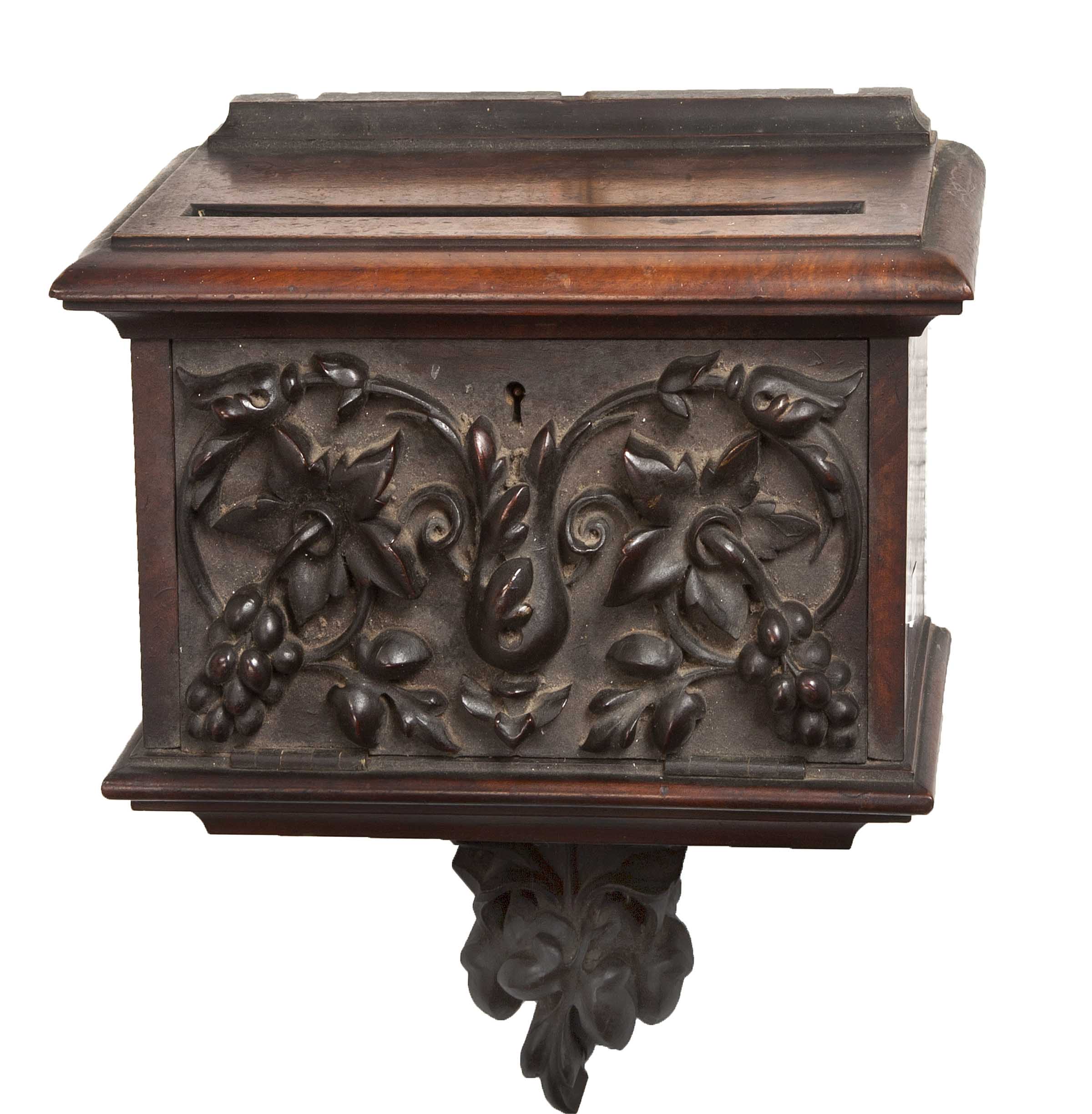 A CARVED MAHOGANY DOMESTIC POSTBOX, 19th century, the top with letter slot above a drop-down door,