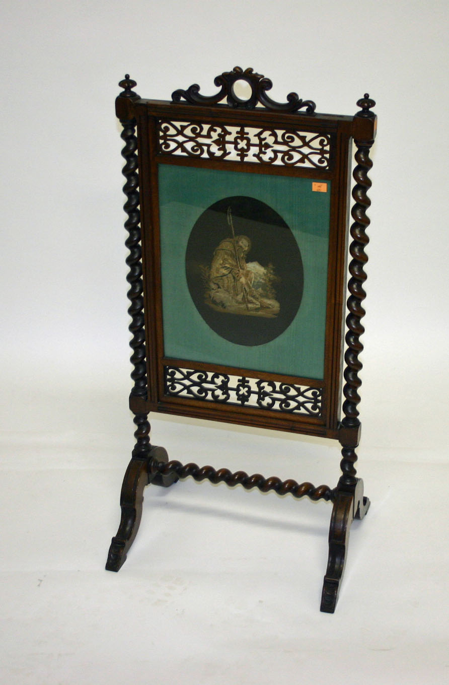 A MAHOGANY FIRESCREEN, 19th century, the needlepoint screen within a pierced surround and spiral