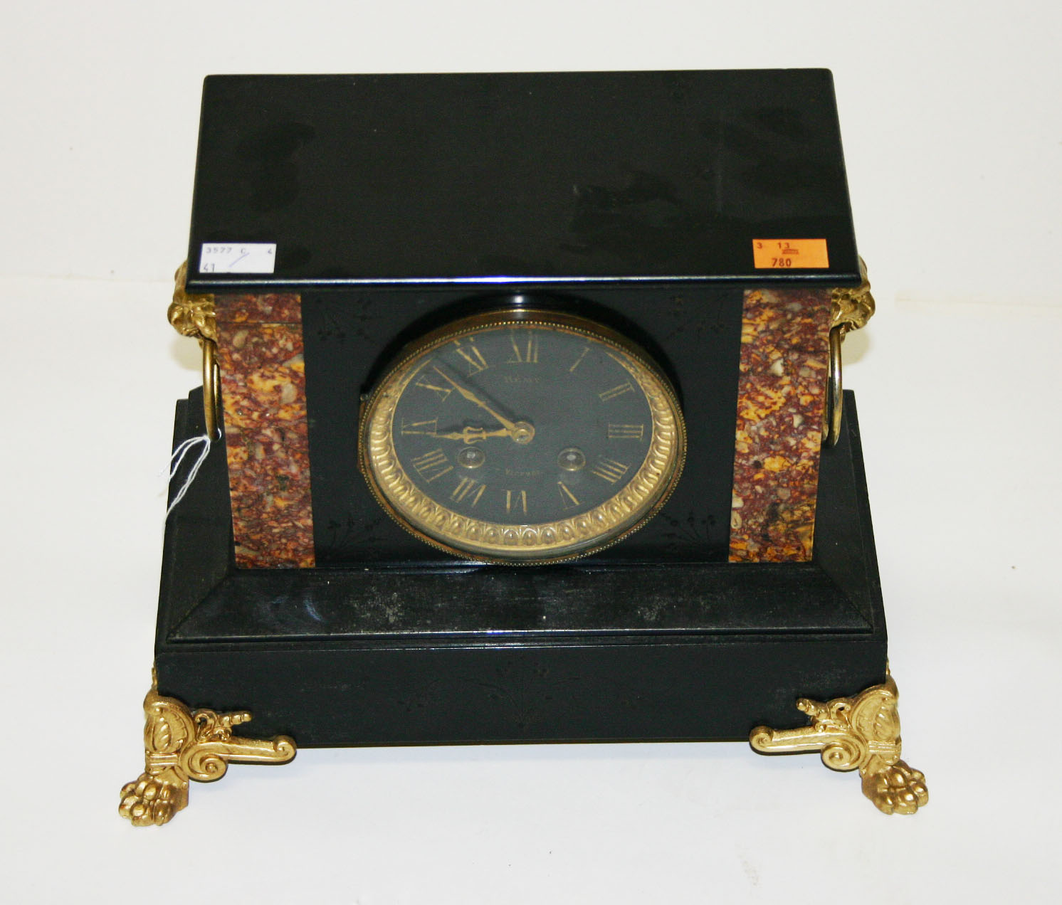 A SLATE AND ROUGE MARBLE MANTEL CLOCK, early 20th century, the circular parcel gilt dial with