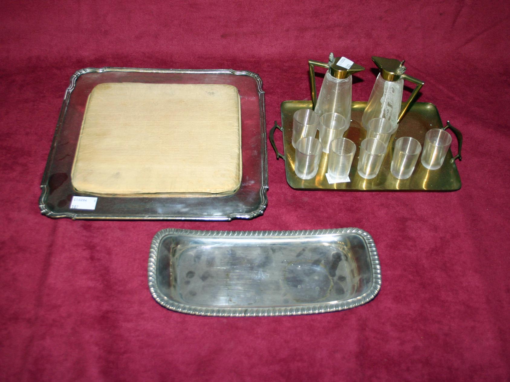 A RECTANGULAR SILVER PLATED TRAY, C.1900, with bead moulded edge and handles, 20in (51cm);