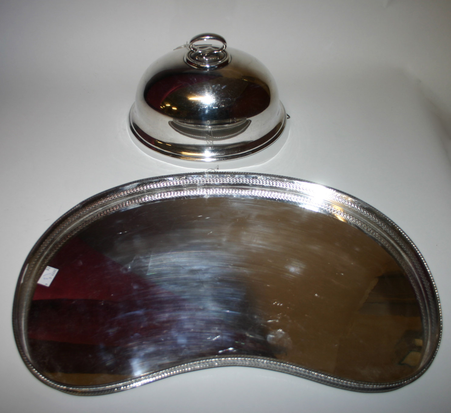 A PIERCED AND KIDNEY-SHAPED SILVER PLATED TRAY, 20th century, with gadroon edge, 20in (51cm); and