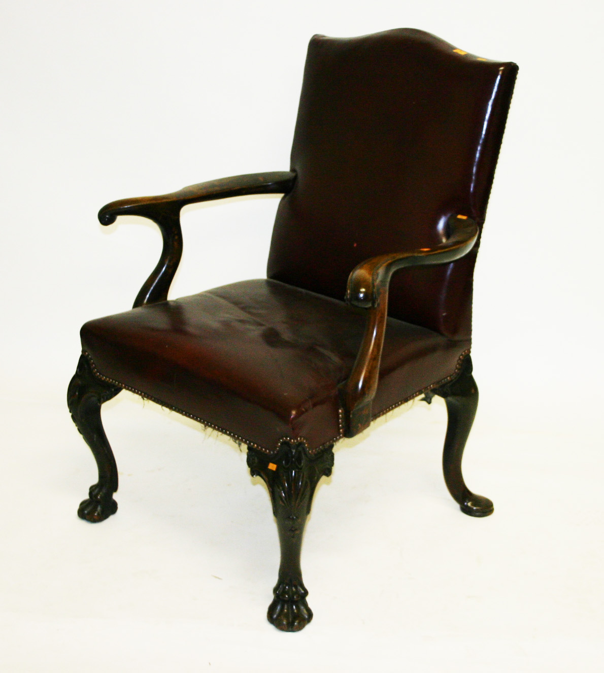 A GAINSBOROUGH TYPE LIBRARY ARMCHAIR, probably Irish, with arched and padded back and straight