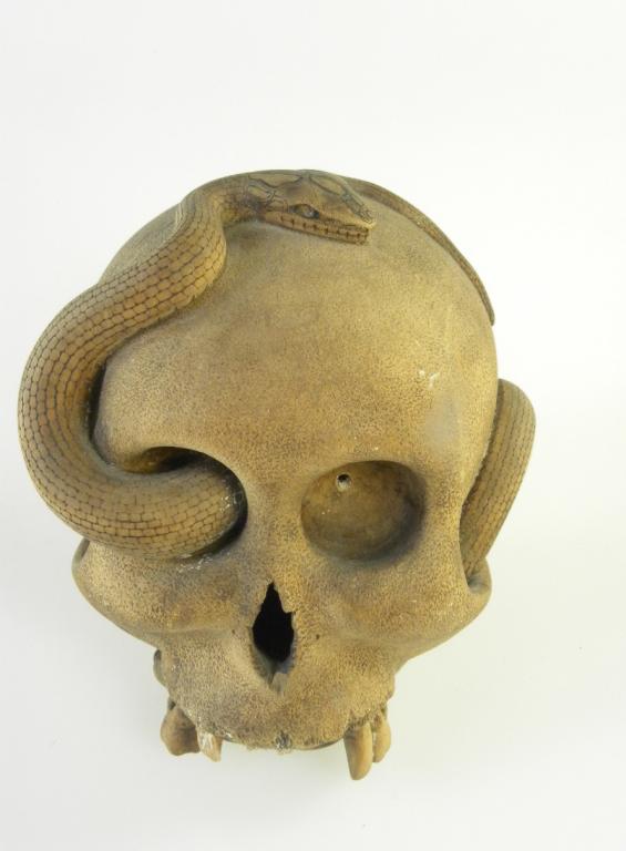 A JAPANESE CARVED WOOD OKIMONO OF A HUMAN SKULL AND SNAKE, SIGNED RYOSUKE ZO