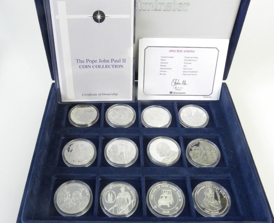 THE POPE JOHN PAUL II COIN COLLECTION. A SET OF TWELVE PROOF SILVER COMMEMORATIVE CROWN SIZED COINS,