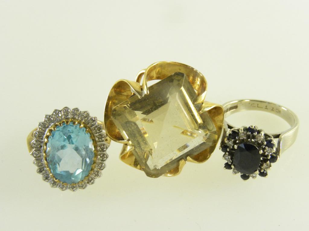 THREE CITRINE AND OTHER GEM SET RINGS IN GOLD OR WHITE GOLD