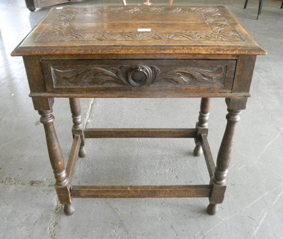 A VICTORIAN CARVED OAK SIDE TABLE