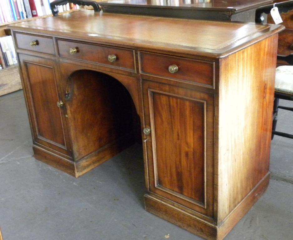 A VICTORIAN MAHOGANY KNEEHOLE DESK WITH LEATHER INLET TOP, ADAPTED