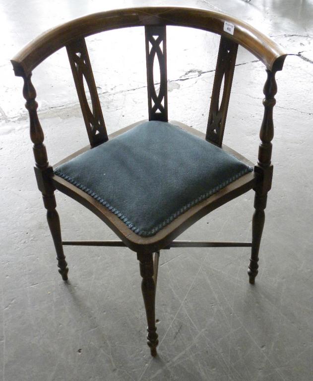 AN EDWARDIAN INLAID BEECH CORNER CHAIR