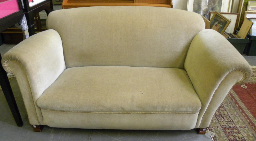 A DROP ARM SOFA UPHOLSTERED IN MINK DRALON