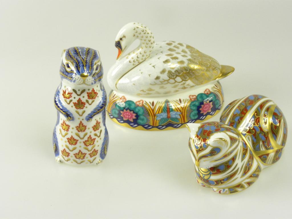 THREE ROYAL CROWN DERBY PAPERWEIGHTS INCLUDING A SWAN