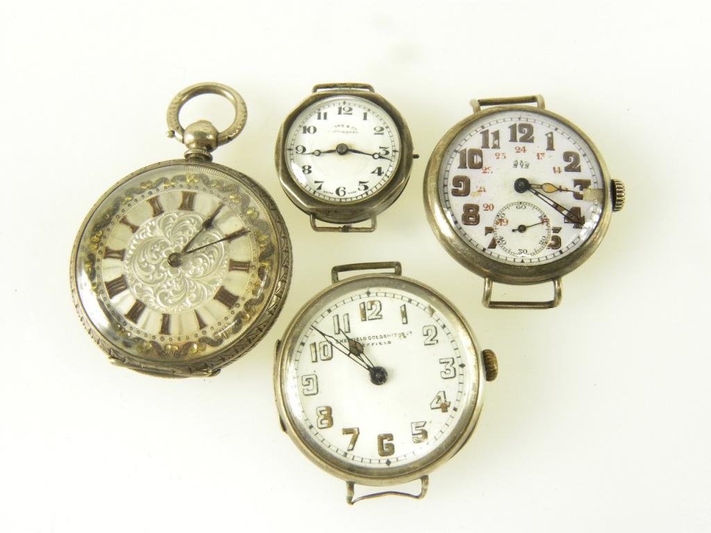 A SILVER WATCH AND THREE VARIOUS SILVER WRISTWATCHES