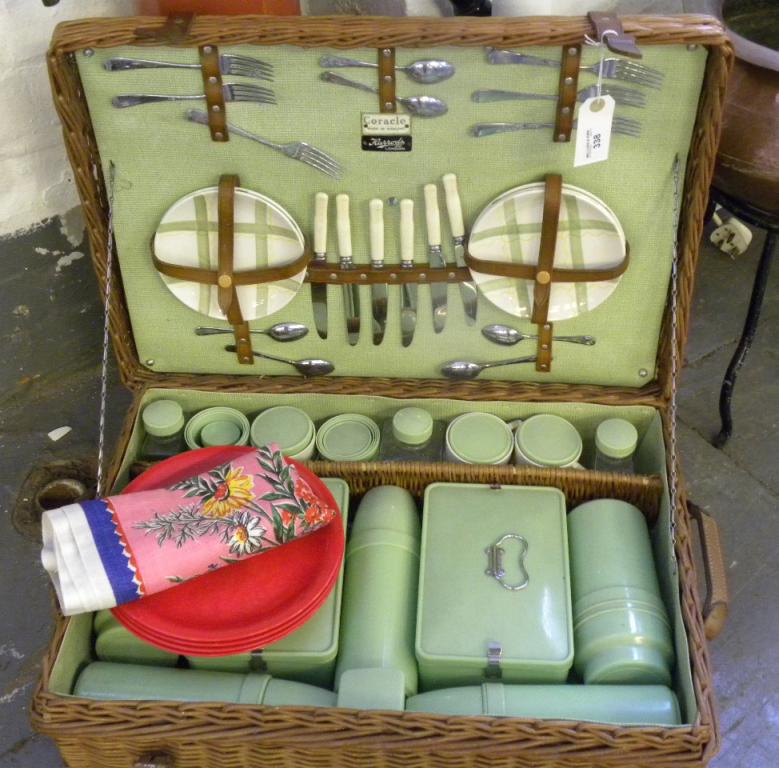 A CORICAL FITTED WICKER PICNIC HAMPER BY HARRODS LTD, GREEN PLASTIC FLASKS, SANDWICH BOXES AND