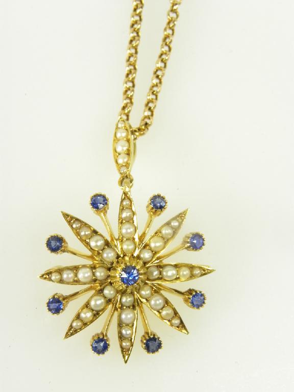 A SAPPHIRE AND SPLIT PEAR PENDANT MARKED 15CT, EARLY 20TH C ON GOLD NECKLET, 11G