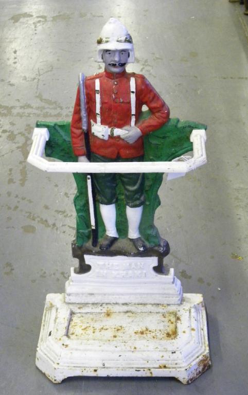 A PAINTED CAST IRON FIGURAL UMBRELLA STAND IN THE FORM OF THE MAN IN KHAKI