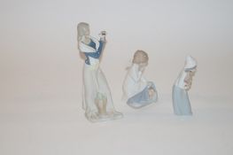 Two Lladro figures and other similar figure