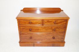 A light mahogany chest of two short and two long drawers