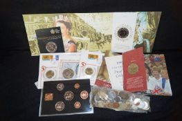 A collection of coins, including some commemorative