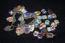 A silver charm bracelet along with various British and continental silver charms