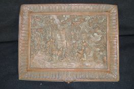 A copper relief plaque