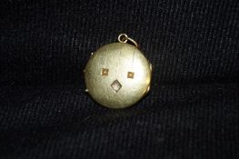 A French art deco gold and diamond locket