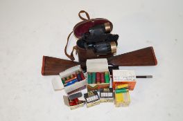 A collection of miscellaneous items including cartridges, stocks, etc