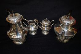 A four piece Indian white metal tea and coffee service including teapot, coffee pot, milk jug and