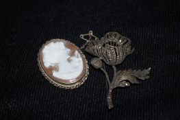 A cameo brooch on a silver mount, along with a Scottish silver brooch