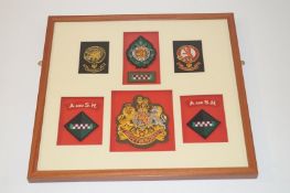 A collection of Argyle and Sutherland Highlanders framed ceremonial and working dress badges to