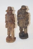A pair of carved wooden figures