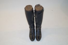 Pair of hunting boots with wooden shoe trees