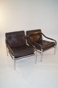 A pair of leather and chrome Preff chairs