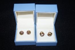 Two pairs of 9ct hoop earrings set with Sapphires and Rubies in David Christopher Boxes.