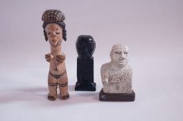Three small carved figures
