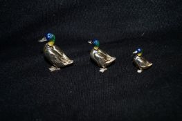 A set of three silver and enamel "Duck" ornaments